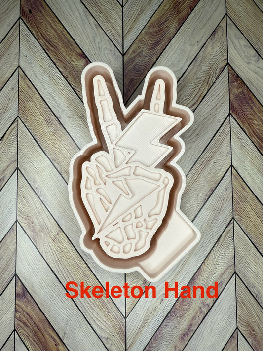 Skeleton Hand Holding Lightning Bolt